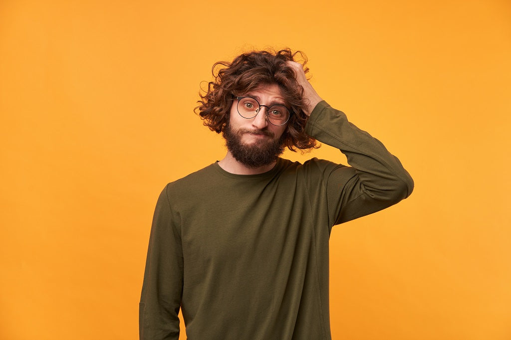 A Simple, Low-Maintenance Guide To Maintaining Long Curly Hair For Men